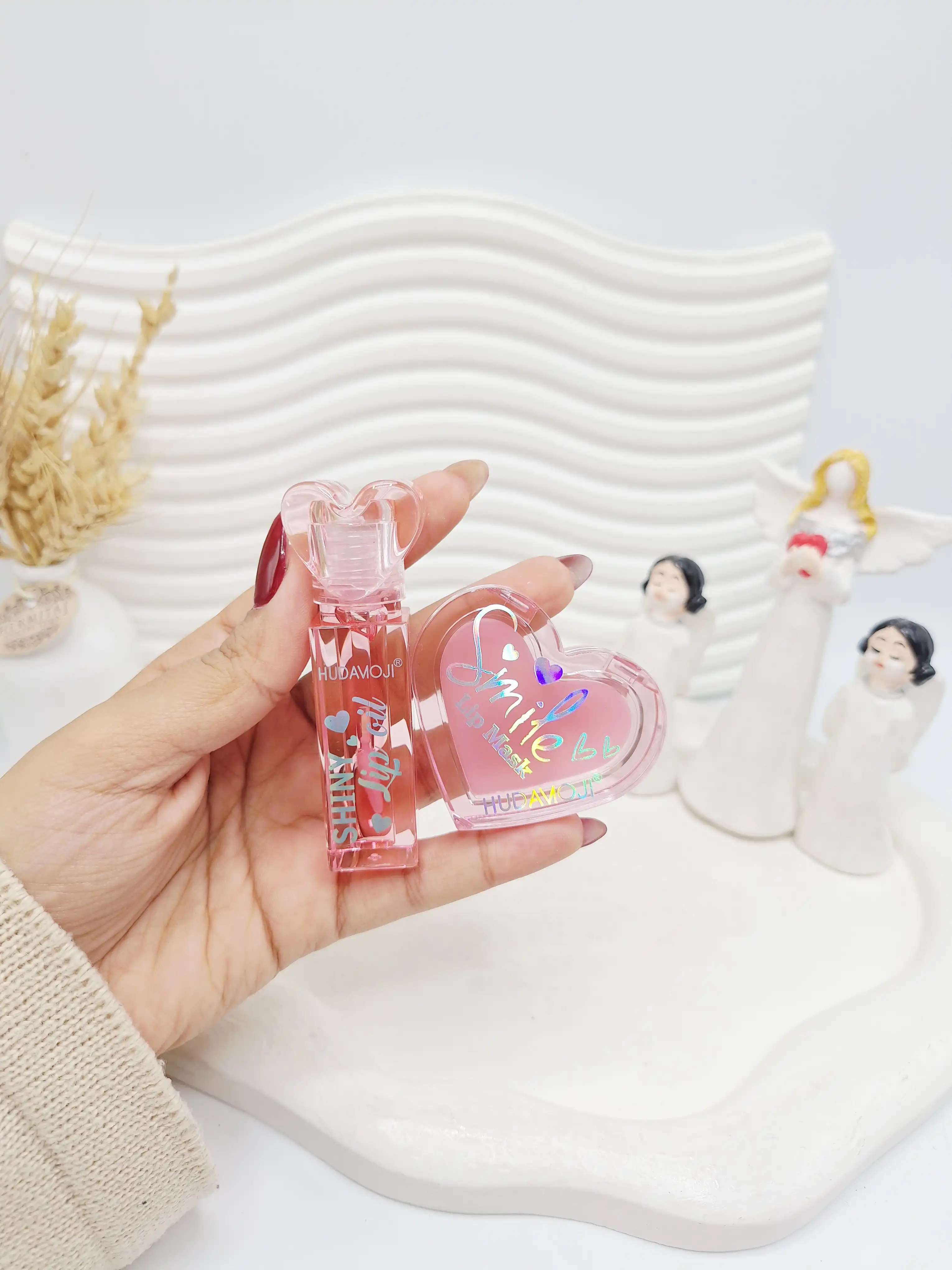 ست 2 تایی بالم لب و لیپ گلاس طرح قلبی برند هدا موجی کد 4421